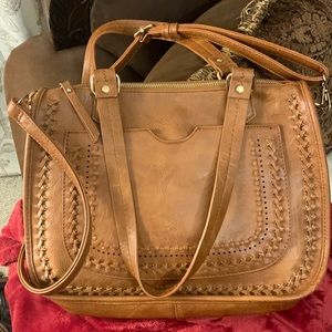 Can be carried as a tote or used as a crossbody bag